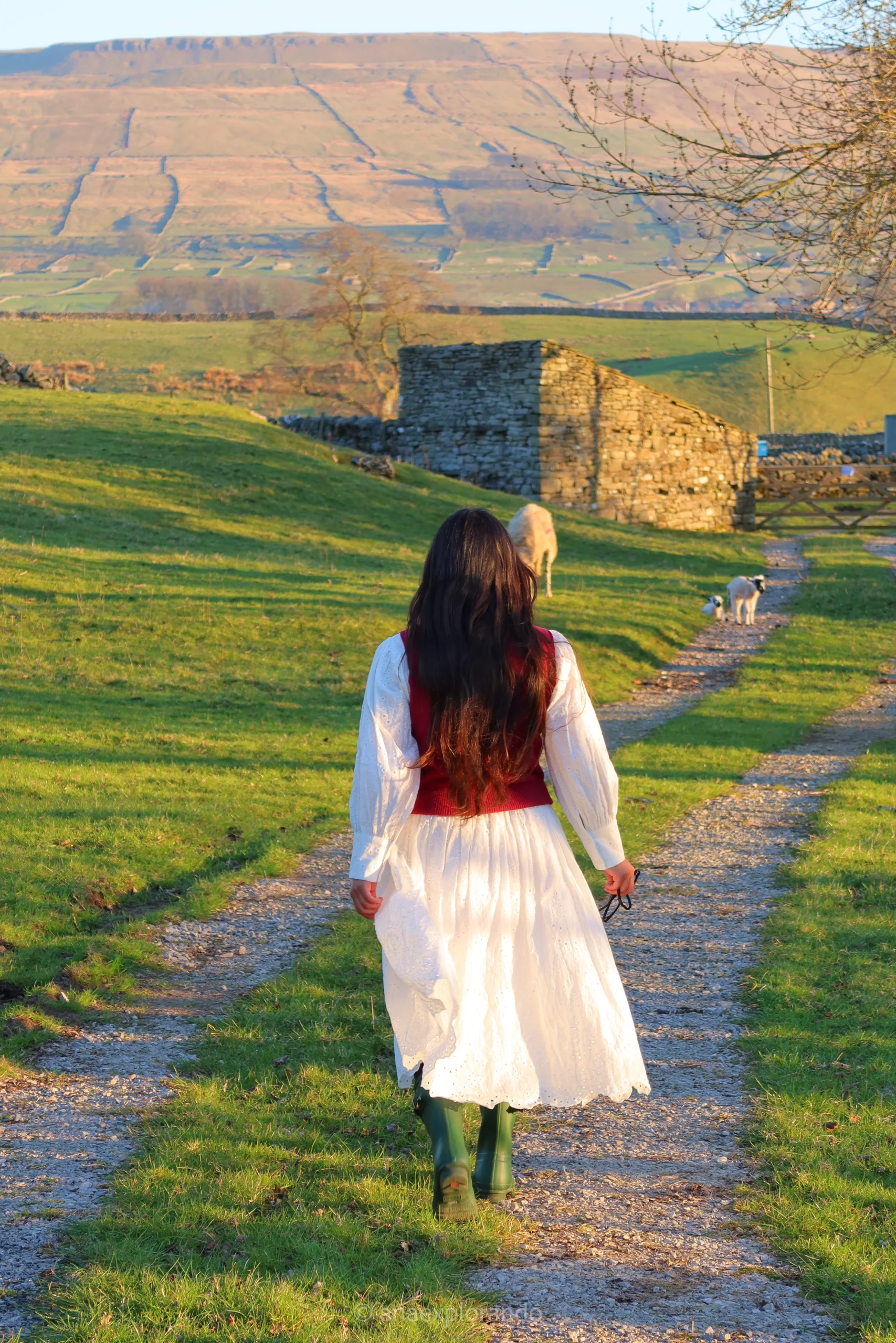 Woman walking down a country road